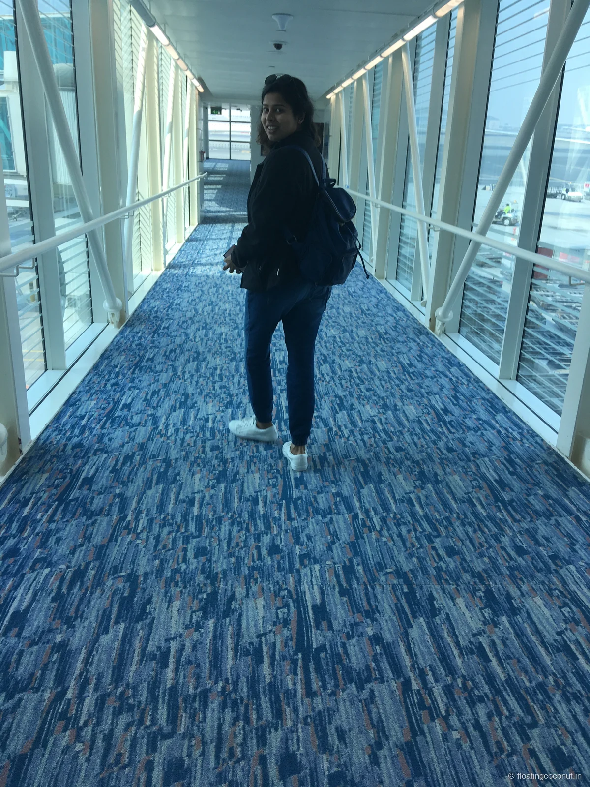 This has now become a tradition for us - clicking a photo when walking out. This is anjali walking out the ramp in Dubai.